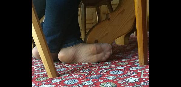  my girlfriend is resting her feet in tan nylons